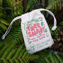 Tree Snap New Zealand's Native Tree Game, beautiful cards in a cotton drawstring bag on a bed of fern leaves.