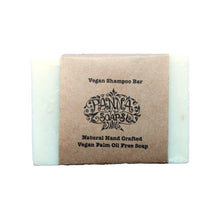 Solid vegan shampoo bar with minimal paper packaging.